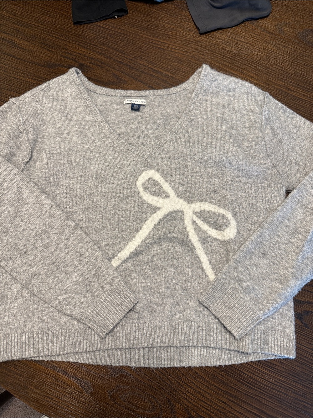 American Eagle Outfitters Gray V-Neck Sweater with White Bow Detail